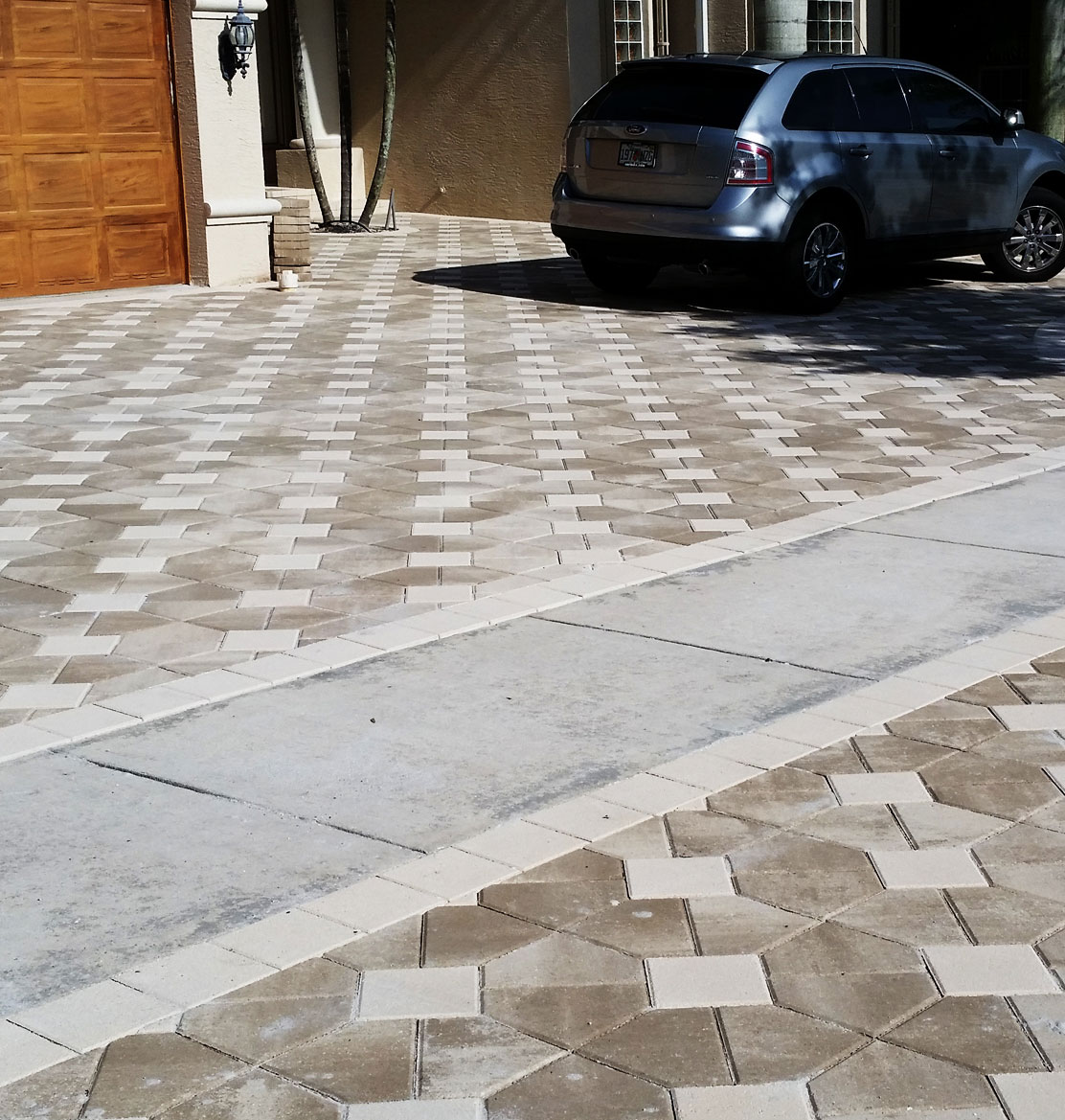  bright pavers with a car on top